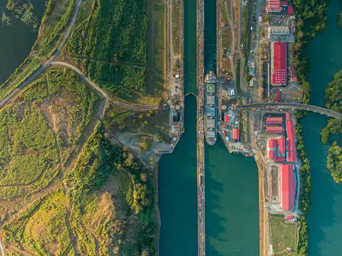 Panama Canal seen from above, a global maritime hub and hotspot for hull cleaning and other underwater operations. 